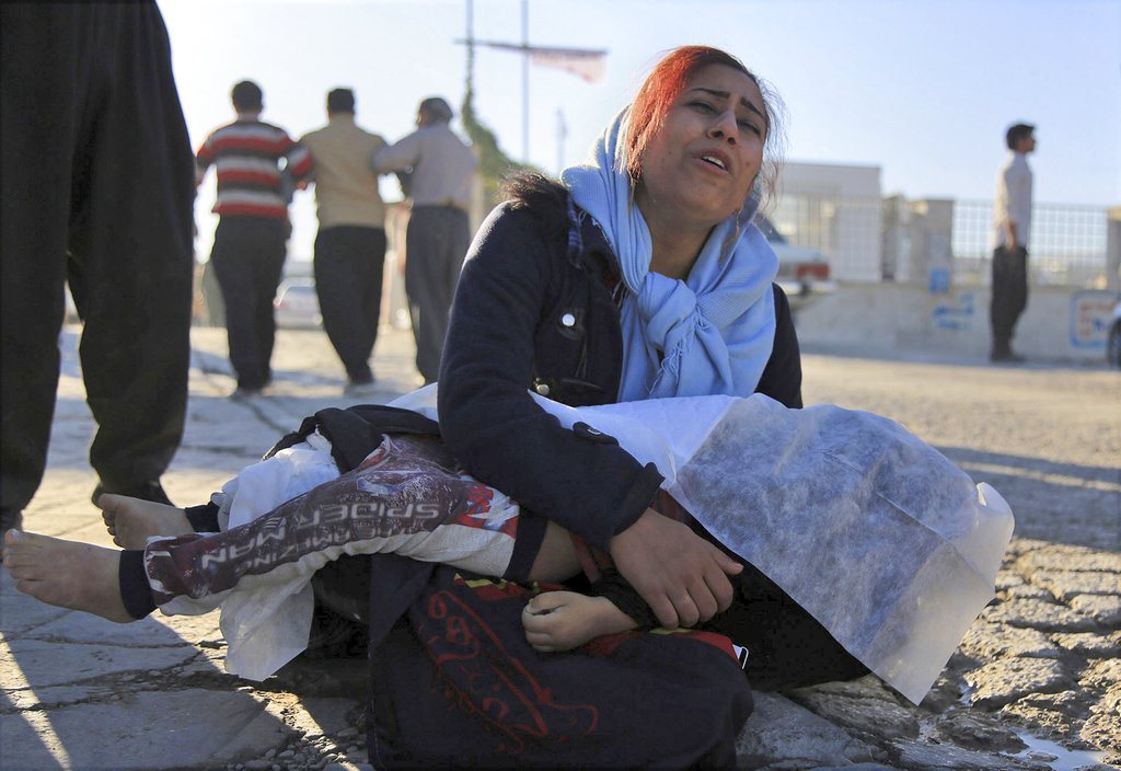 Rescuers dig through debris after Iran-Iraq border quake