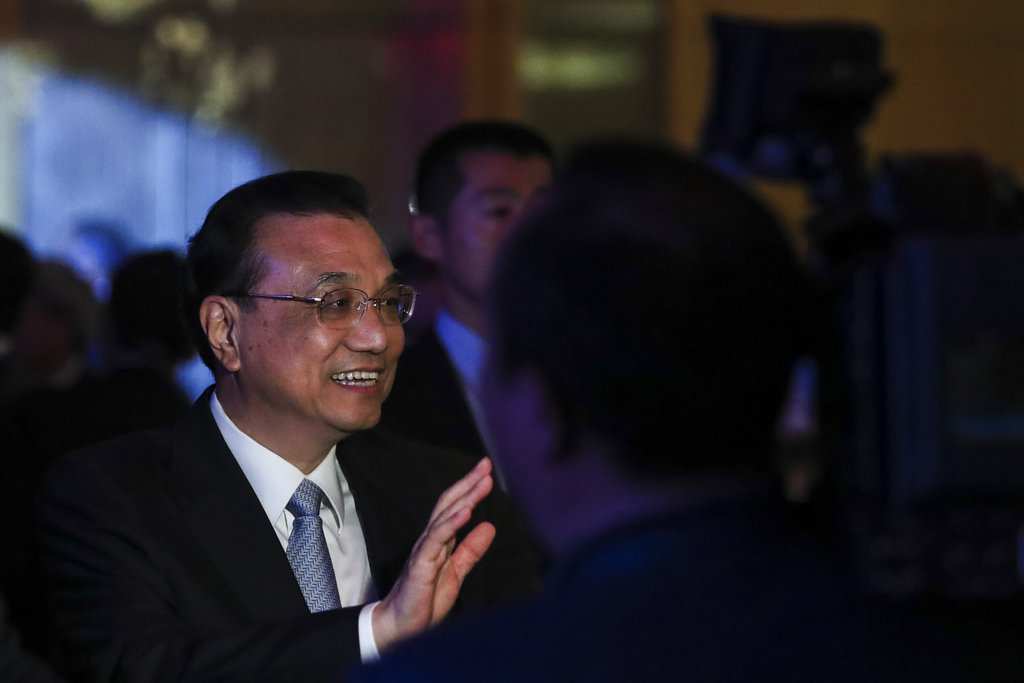 China's premier reassures region on growth, South China Sea