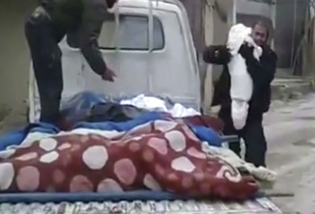 In Syria, a father says last goodbye to dead child