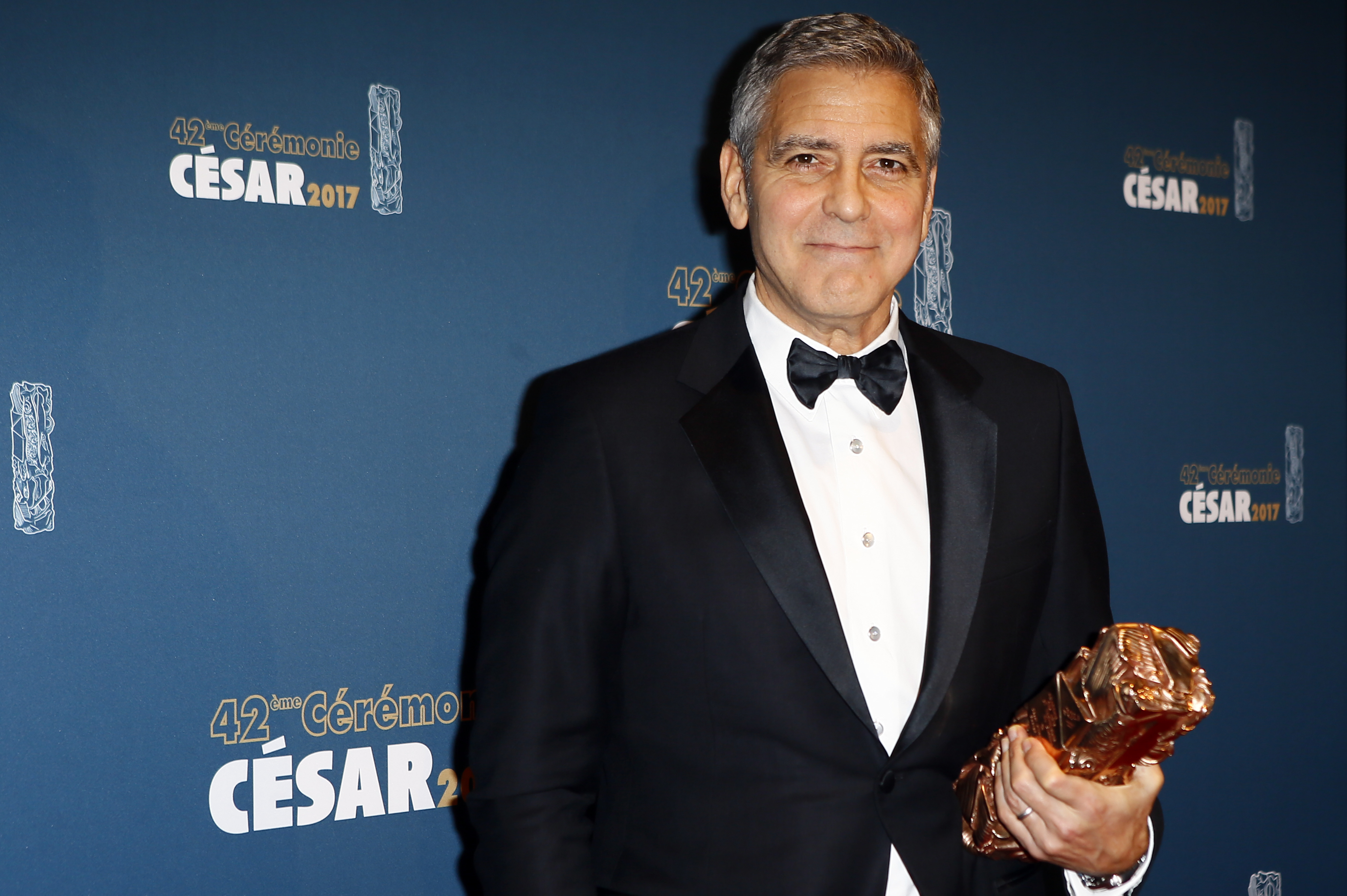 Clooney uses Cesar award to warn about hate in age of Trump