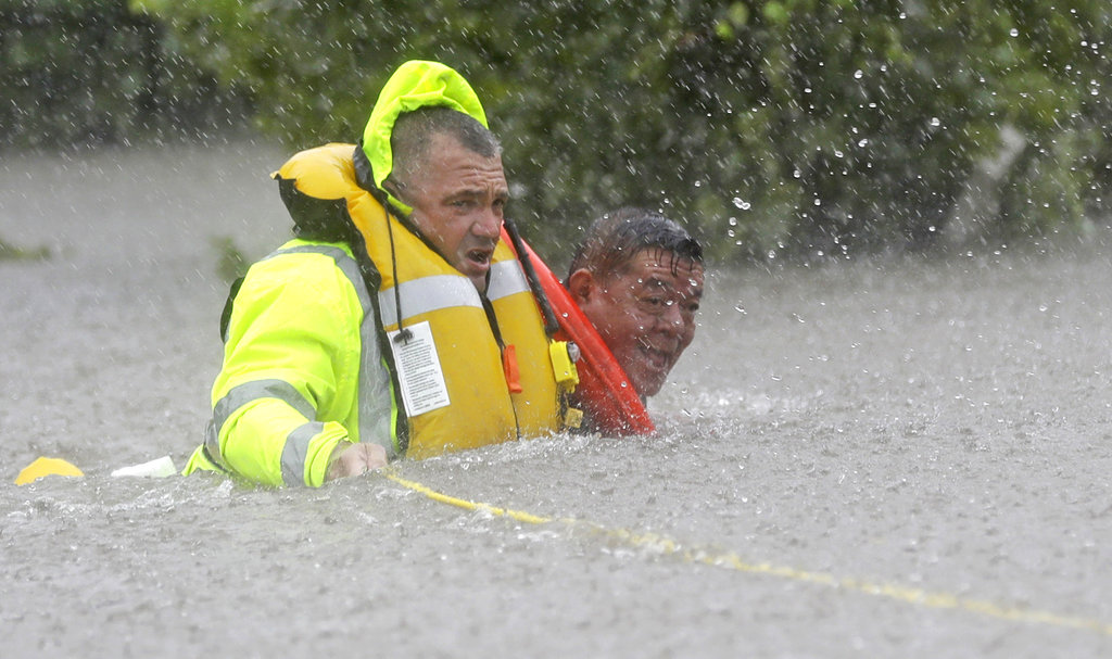 Catastrophic floods strike Houston; thousands flee homes